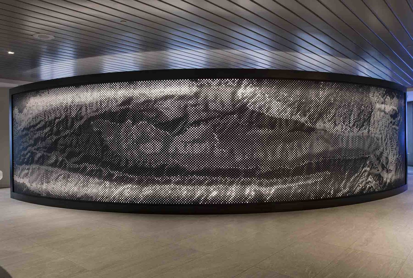 Arktura Graphic Perf backlit on a curved wall