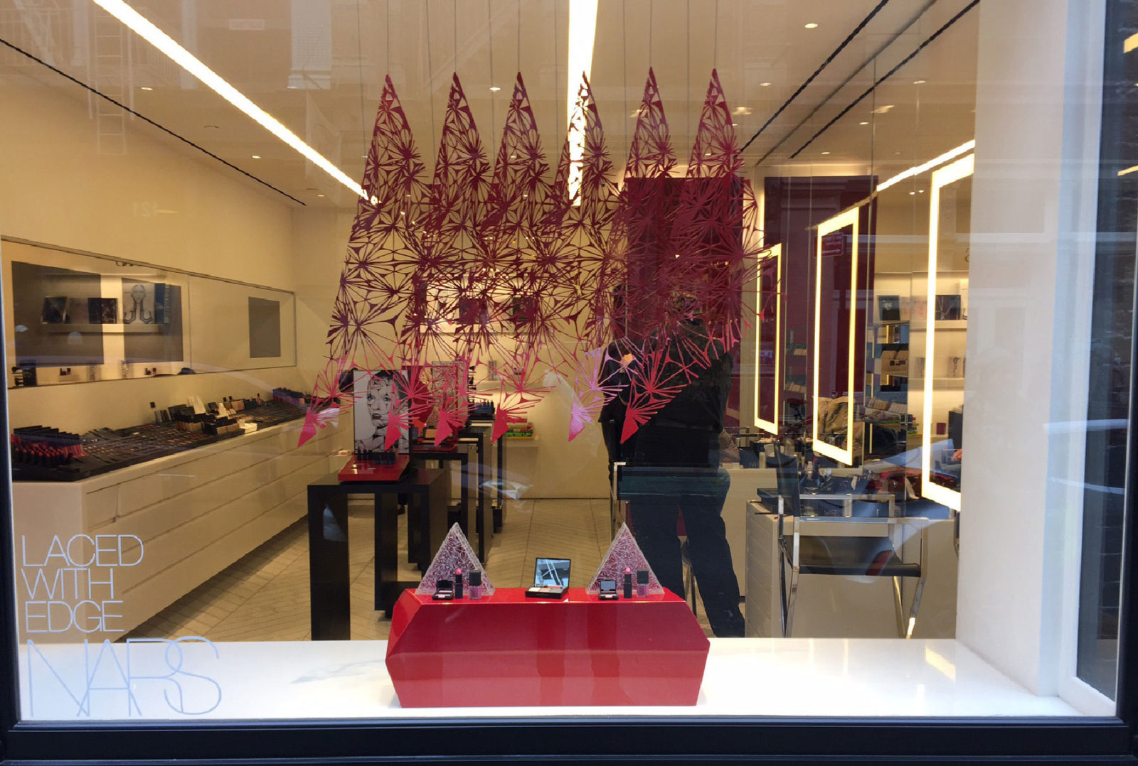 Perforated display panels and product pedestals for NARS by Arktura Solutions Studio