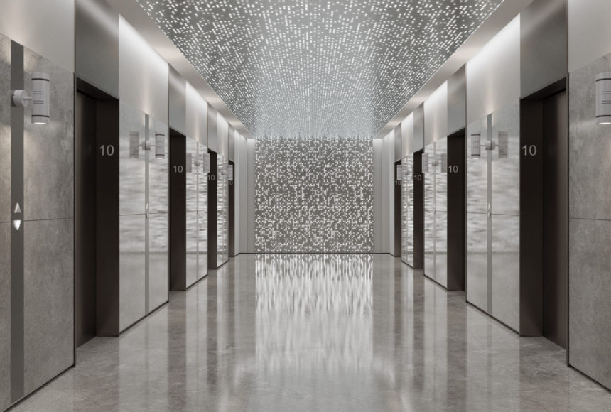 Arktura Vapor® Syntax with backlight installed on the ceiling and wall of an elevator lobby.