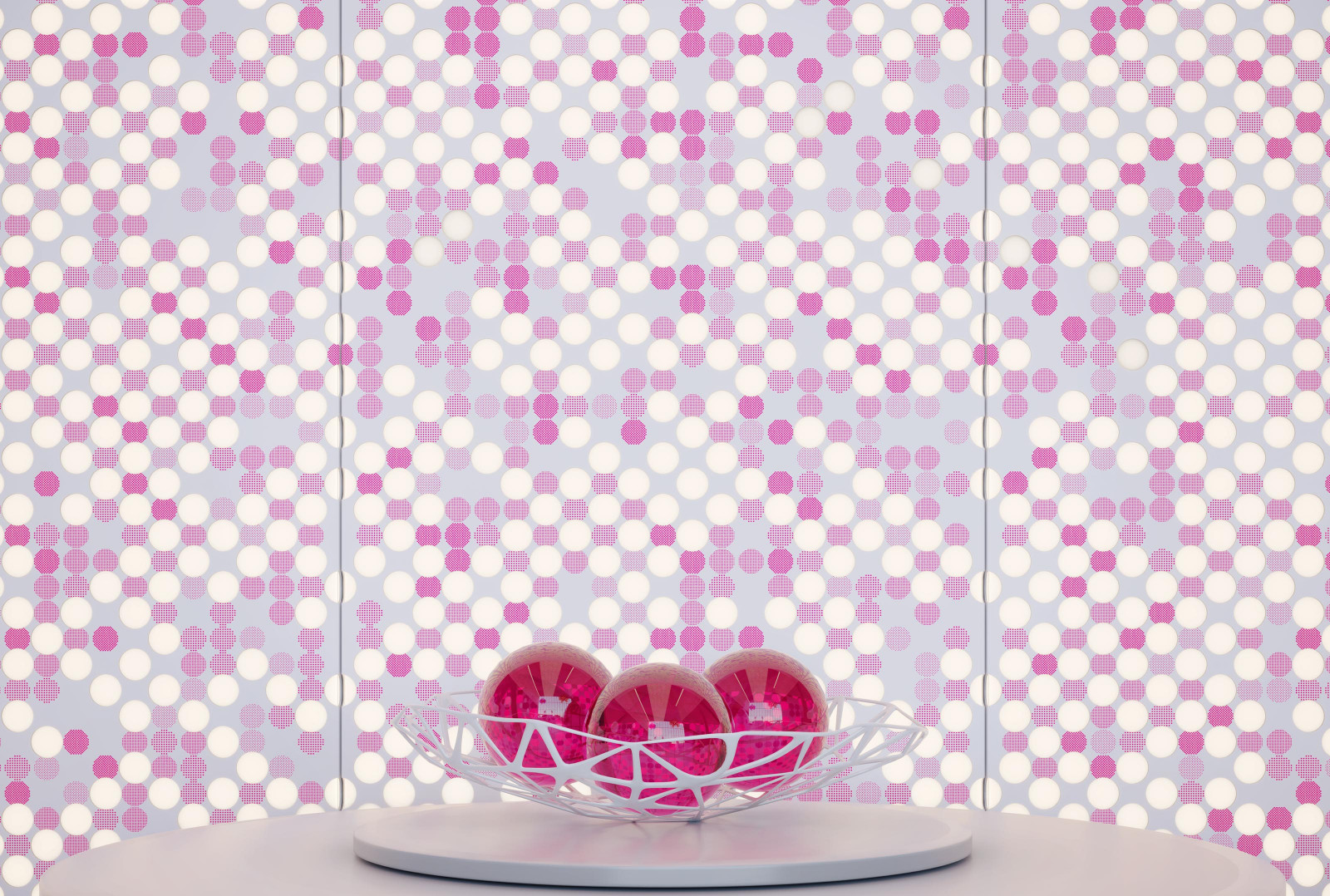 This grey table has a bowl holding three pink balls. The wall behind the table is pink, white and grey VaporHue™ Pop panels with integrated backlighting.