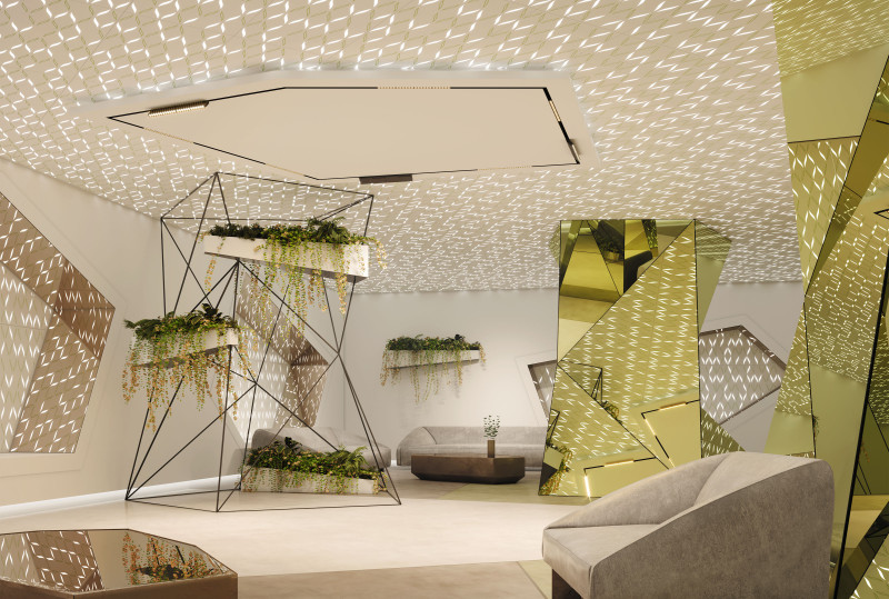 This room, featuring a VaporHue™ Stitch design in Ceiling and Seating Coves in pall application with Arktura Backlighting the Printed and Perforated Arktura VaporHue™ Panels. The space has colors of green and white throughout filled with reflective volumetric forms, There is a large metal frame echoing the volumetric forms holding plants and some seating areas in the space. 