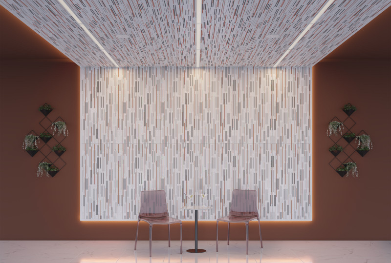 This small seating area has two translucent red chairs. The wall area has VaporHue™ Astra panels featuring Arktura Soft Sound® Backer in Graphite, centered on the wall transitioning seamlessly to the ceiling, which features Arktura In-Line Lighting, and there is rust orange paint on the sides of the panels. There are hanging planters featured on the walls flanking the panels. 