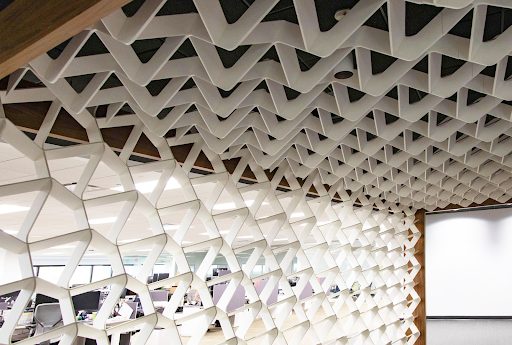 This space incorporates white SoftGrid® Wave panels into the design.