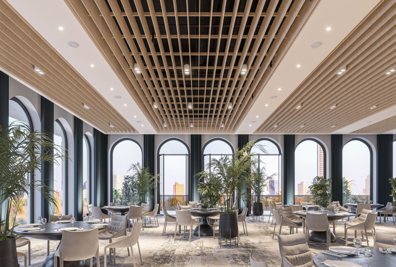 This restaurant features round tables, arched windows, white chairs, large plants and Arktura ceiling baffles.  